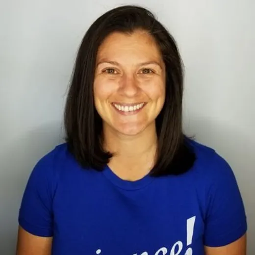 Samantha Spivey smiling, wearing a blue t-shirt